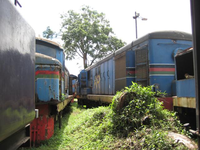 A cluster of sad-looking diesels stand behind 3020 in the Nairobi workshop