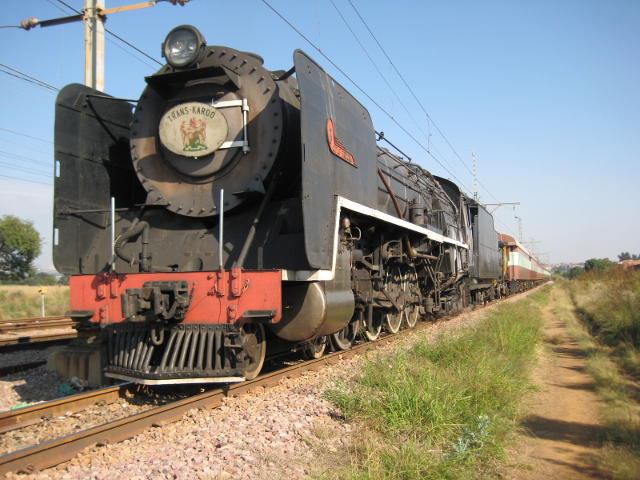Standing near Eerstefabrieke waiting to cross a Metro. The name board is from Nathan's collection, carried today in honour of an old Kimberley driver