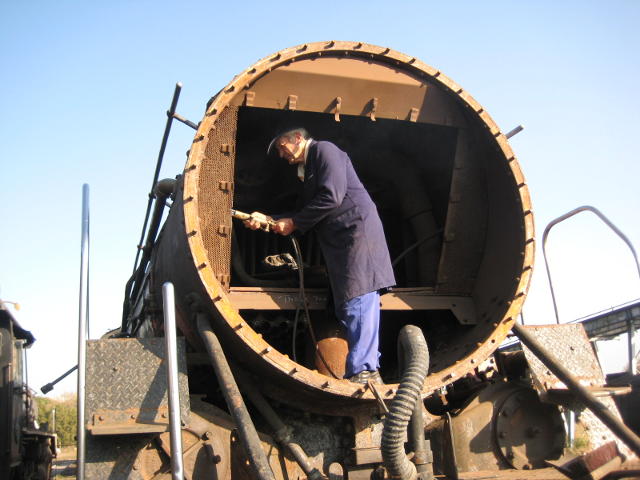 Turns out it's just Uncle John removing the spark arrestors, table plate and blast pipe so that we can replace some of the tubes