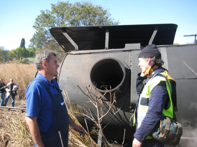 Steve and Nathan chat by the chimney