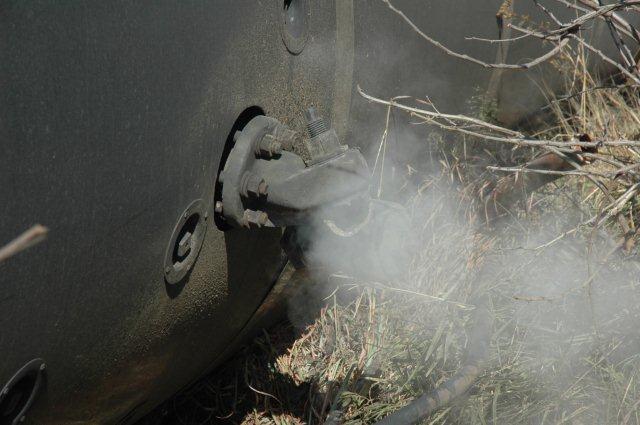 Shorn off clack valve still blows the escaping steam from the boiler.