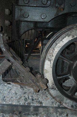 close up of cowcatcher just clearing leading bogey wheel