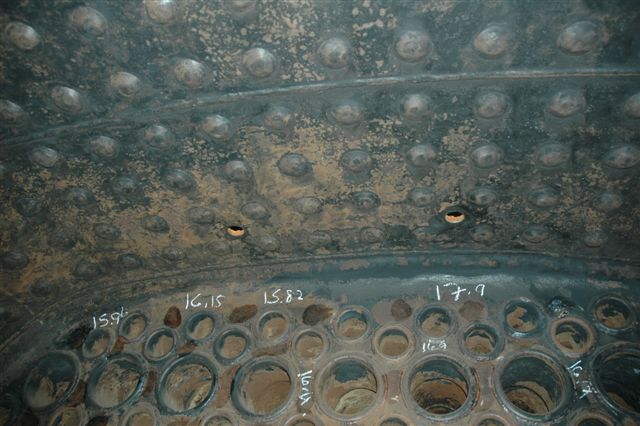 Looking up at the front row of tubes in the 15F firebox, you can clearly see the two holes where the fusible lead plugs will be placed, once the boiler<br />internal inspection is completed. The white chalk notations are the results of the ultrasonic testing that is regularly carried out on FOTR equipment by Brian Dadford.