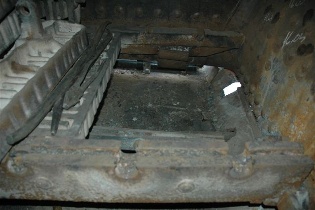 Inside the huge firebox, work has been carried out on removing the first two rows of firebars, so as to enable patches to be put on various holes in the ashpan, to prevent veld fires. Viewed from the driver's side of the<br />firebox towards the fireman's removed front grates. You can't help noticing where the patch will be placed!