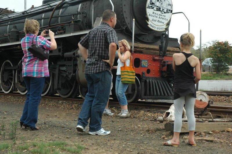 The call of a steam train. Prior to departure, the passengers have opportunity to examine the locomotive and get their photos.