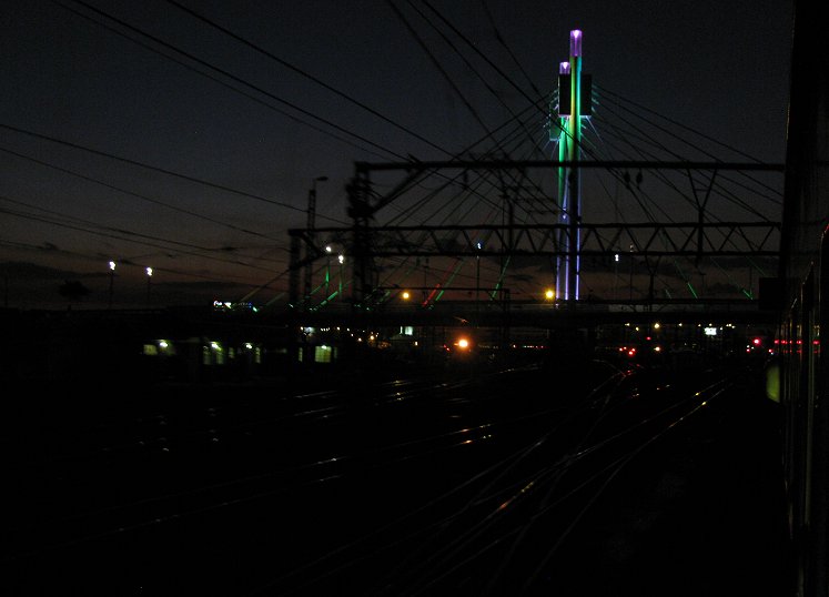 Passing under the Nelson Mandela Bridge towards Park Station.
