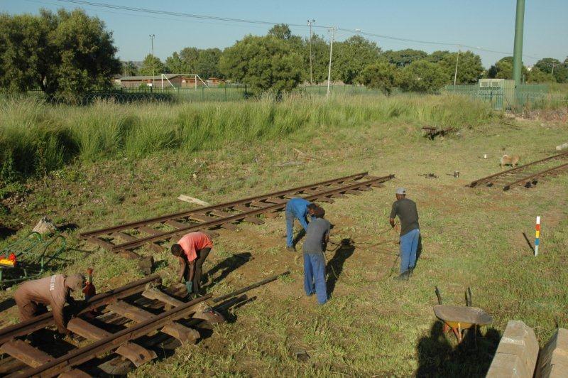 A long way to go but it got there. The track panel seen in the background is a lighter track to what is being laid and will be used further down.