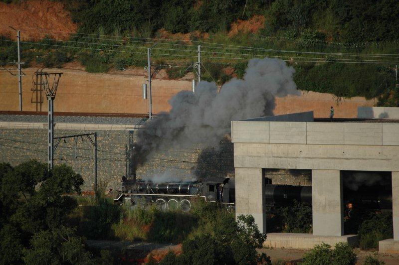 Friends of the Rail 19D heads upgrade under the Gautrain bridge just on the outskirts of Pretoria station. The Gautrain line can be clearly seen in the background.