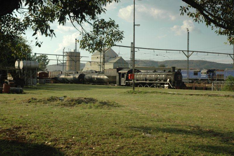 Late afternoon at the site. The 19D will spend the night here before heading off to Germiston to collect the GMAM garratt. The TFR shunting yard is quiet with the diesel shunt locomotives shut down.    Silence. Soft sunlight and beautiful green grass. Tranquility on track!