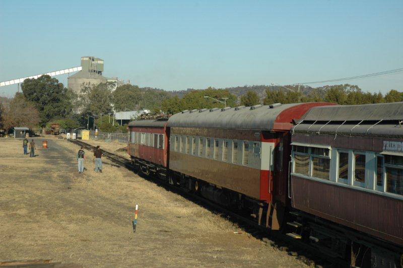 Getting closer to the stopblock. Raymond and Welcome, the site helpers, come forward to admire their assisting handiwork.