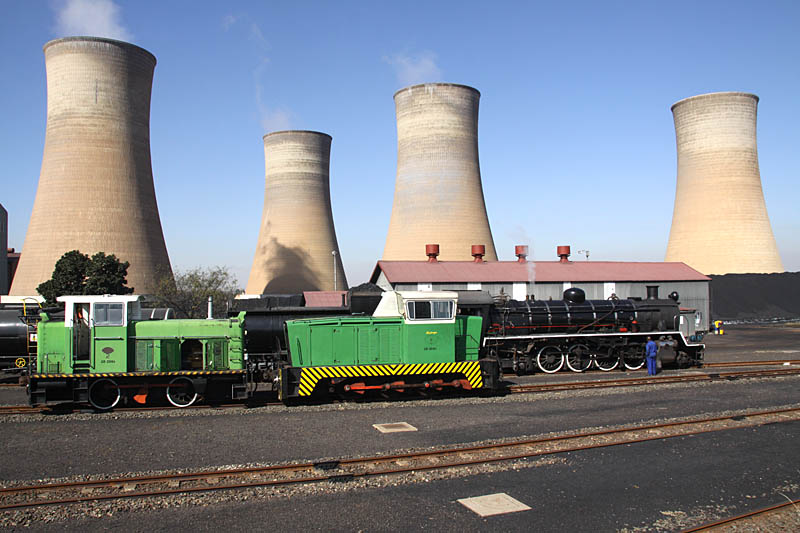 Two Rooiwal diesels and a 24 class in the shadow of the cooling towers