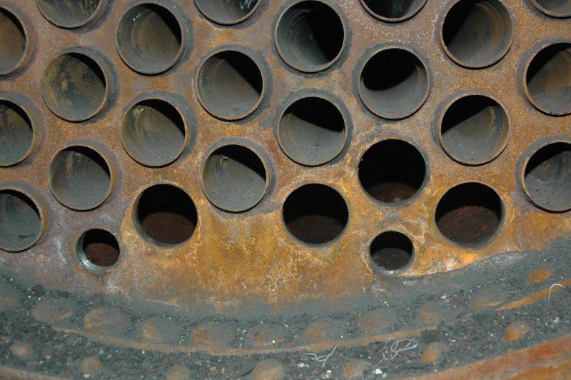 The removed small tubes. The threaded holes are for the washout plugs