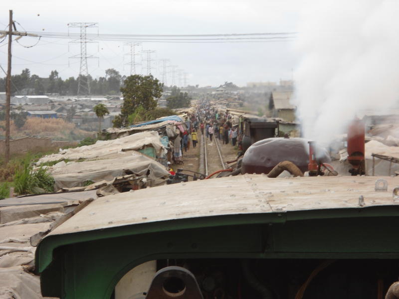 Through the market with the driver hanging on the whistle cord