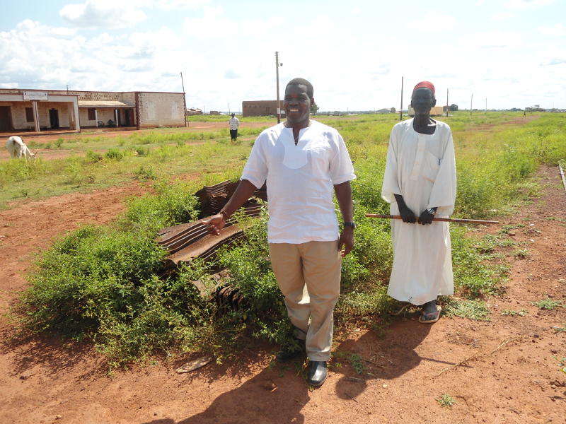 The Catholic Bishop of Tombura-Yambio (left) poses with our guide, Santino, who worked on the railways for 51 years