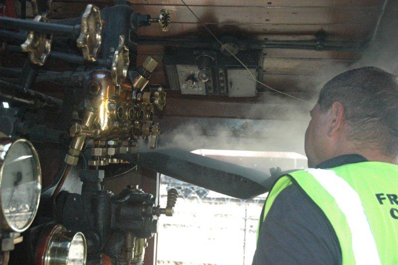 Gabor Kovacs sets the class 24's lubricator prior to departure.