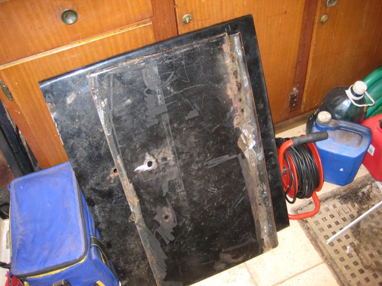 Two roof hatches standing forlorn with their handles removed