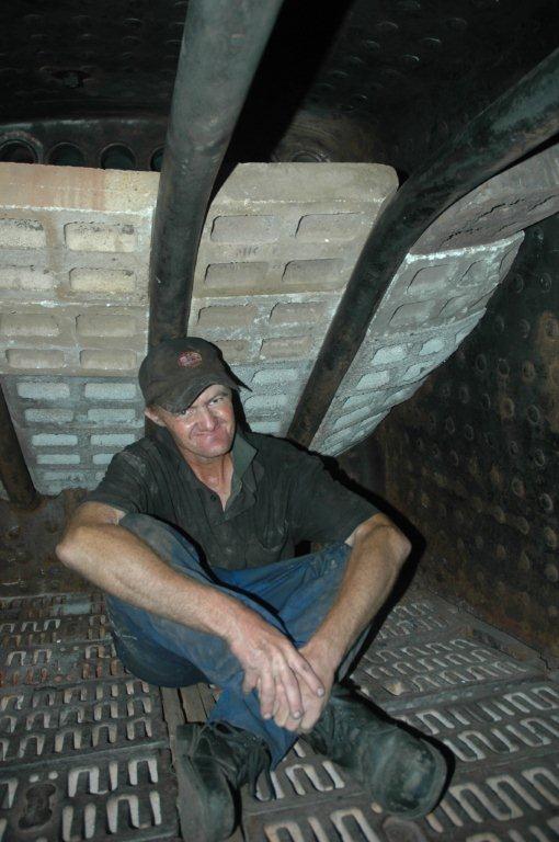 The work is done and Spikkels poses for the camera. These firebricks are very heavy and tremendous effort is needed to get them into the firebox and then up on the arch tubes, to build the brick arch. Now, fire is needed!
