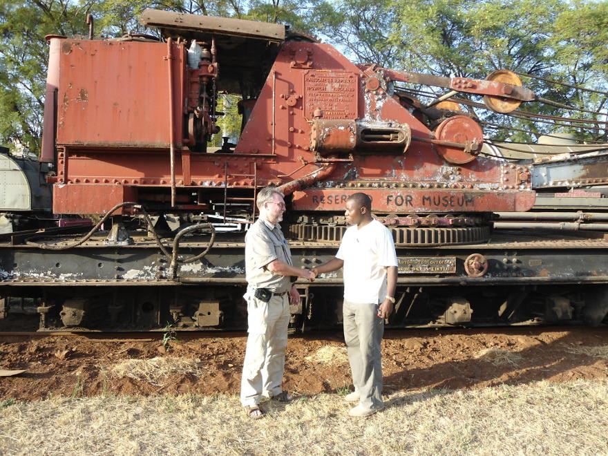 John gets congratulated by Maurice for painting "Reserved for museum" on the steam crane