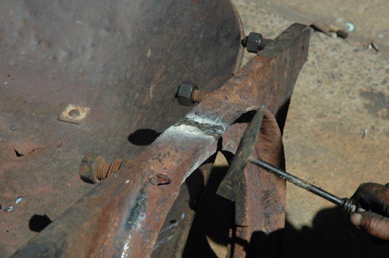 The firebox door frame needed to have a crack welded up. John tackles this task and soon it is fitted into the loco.
