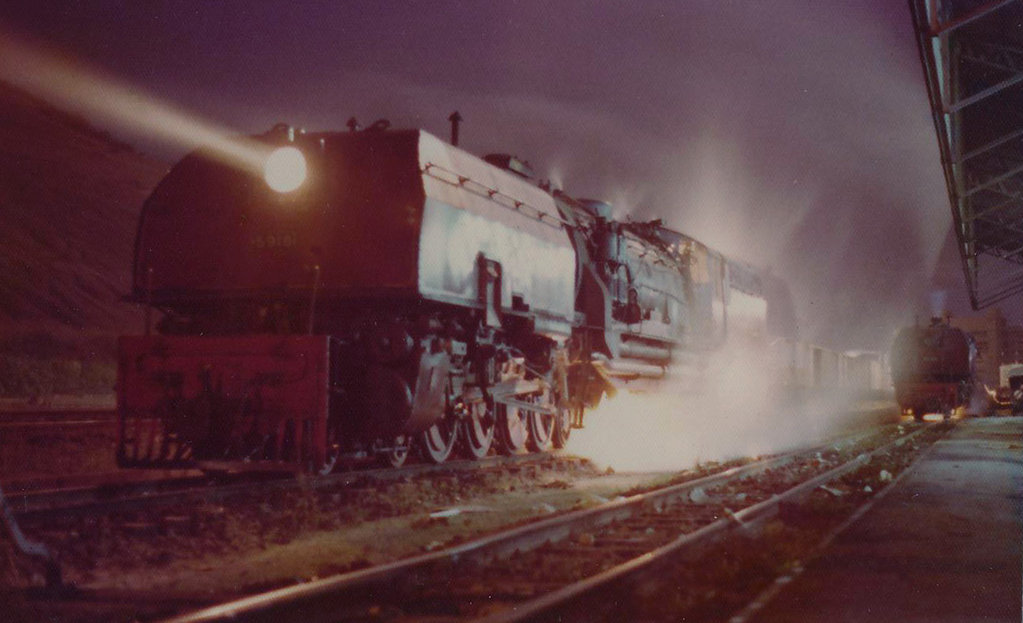 This is 5918 in its heyday.... about to depart from Mombasa Docks at midnight in 1974 with self and Kirpal...