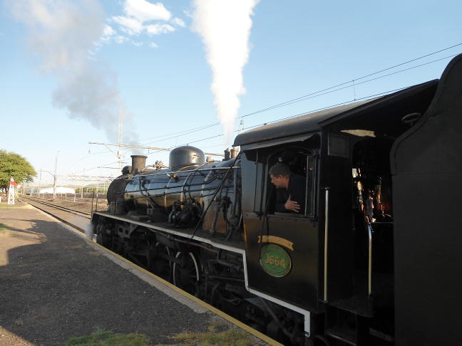 The crew test the safety valves as 3664 stands at the head of her train in Hermanstad Station