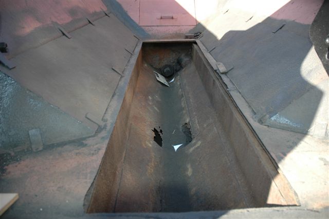 Once the coal had been cleaned out of the tunnel area under the bunker, some holes were revealed, and had to be patched up. A new plate was shaped and fitted. Note the modifications to the tender to enable maximum usage of coal. The angled plates have been fitted to guide more of the dead area coal into the trough.<br /><br />May 2007