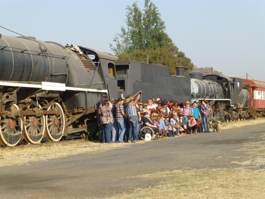 The passengers pose by the old 15F and 24.