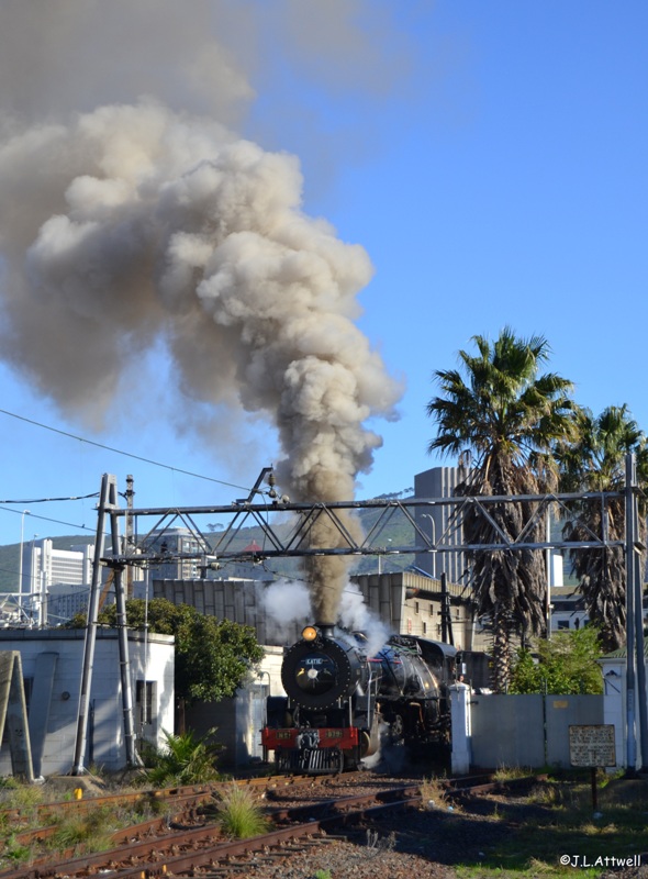 With the passengers onboard and the route set for the mainline, 879 departs monument station with plenty of smoke.