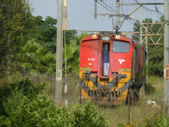 An unusual sight these days - an 18E departing from the container yard