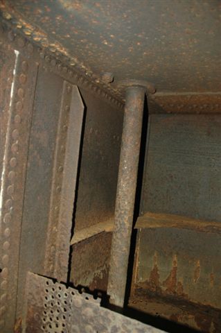 When water is taken from a water column, the overflow on the ledge of the tender would drain out to the ground via two drain holes. Here we see the drain pipes from inside the tender itself. This particular pipe was blocked and rotten and will shortly be replaced. This will go way towards keeping the Fireman's feet dry!!