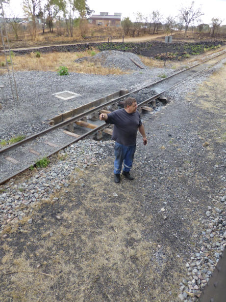 Gabor directs Tony where to stop with the lid of the tender under the water column