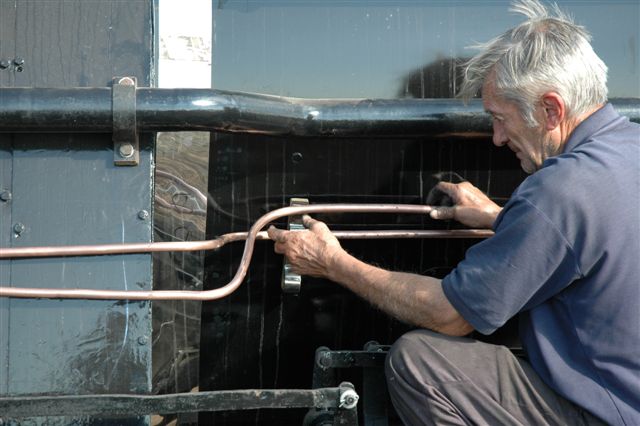 A true perfectionist. John Dadford gets the piping plumb, on the boiler side of 15F 3117. A lengthy restoration indeed, but when you see how meticulous the work is, one can understand why it takes its time.