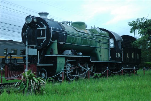 Sil At station has a preserved wood burner plinthed at the entrance. Fortunately viewed as all trains were stopped here due to flooding over the line further along. Passengers were bussed onwards to Chiang Mai.