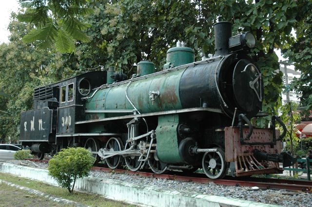 At Chiang Mai station a wood burner is plinthed and looking in a very sorry state