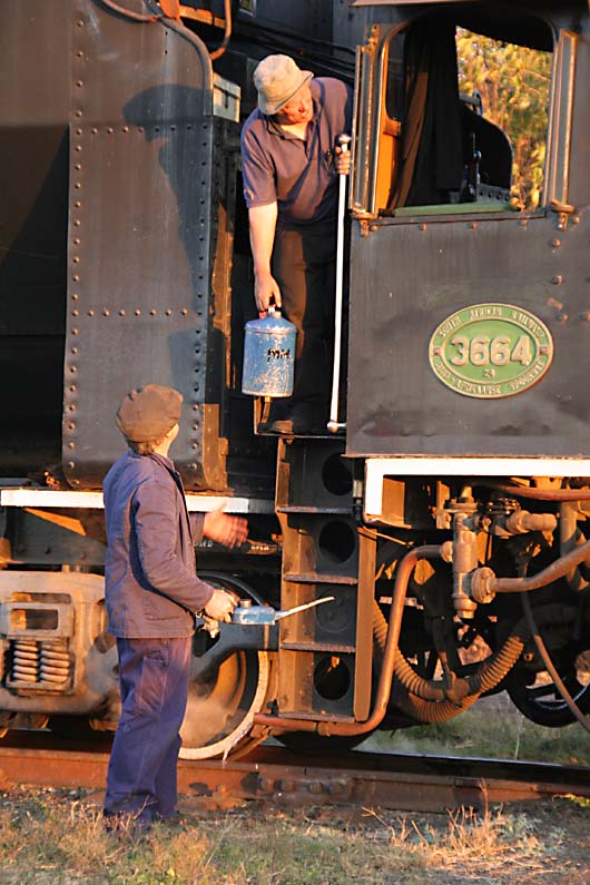 Fireman lends driver a hand with oil bottles