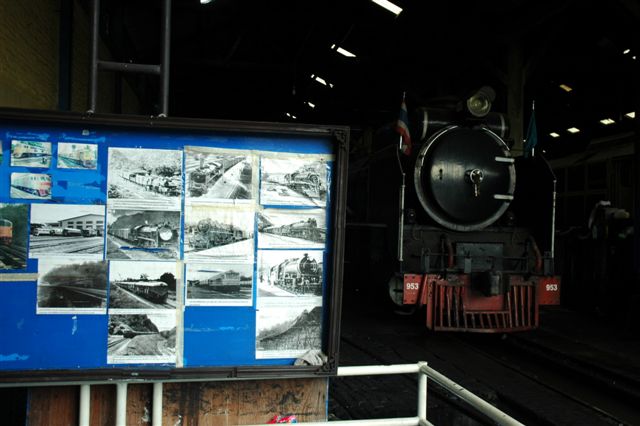 Steam lovers world wide. Various photos adorn the crew rest area in the Thonburri depot, whilst a loco looks on.