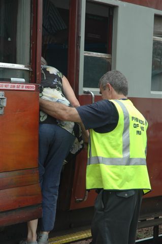 Steve Smith assisting a passenger at Cullinan to reach the platform. Forward in and backwards out is the watchword